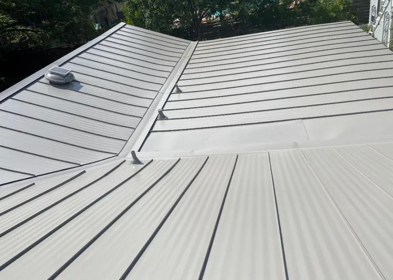 Solar attic fan installed on a metal roof for Roof Ventilation in Cherryland